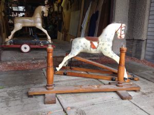 This photo highlights the stand for the rocking horse in its current state.